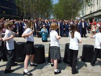 Schoolchildren performing for civic party