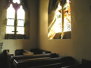 St Felix, pews and stained glass