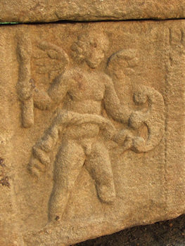 Carved figure on sarcophagus