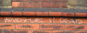 Chalked graffiti - 'Adventure is dead', August 2004