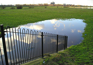 Sky reflected in a large pool of water, Clifton Ings