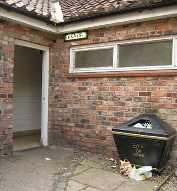 Overflowing bin, and seedy toilet block