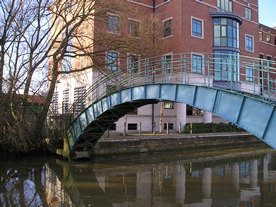 DEFRA building, by the river Foss, Peasholme Green, York, behind a fine old iron bridge. 25 January 2004