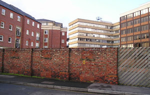 Lovely old brick wall and ugly new Piccadilly