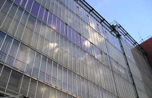 Telephone exchange building, reflecting the sky.
