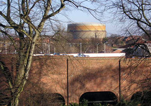 Sainsbury's car park and a gasometer, from the bar walls