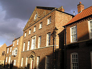 Houses on St Andrewgate, late afternnon, under a stormy sky!