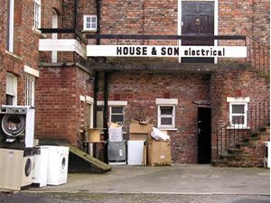 Appears to be storage for House and Son, complete with washing machines. Real life in the shadow of the Minster. Long may they remain