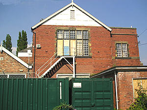 Boarded-up windows, but apparently still in use