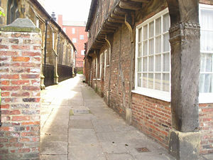 Medieval building and lane by All Saints