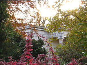 Sun setting over cemetery chapel