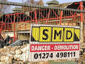 Steel fence and demolition notice