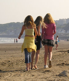 Girls walking on beach
