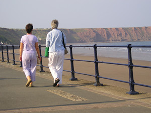 Women walking on Filey seafront